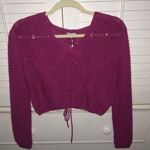 Cropped cable sweater